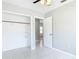 Bedroom features tile flooring, a closet, and an open doorway at 1812 Bayview Dr, New Smyrna Beach, FL 32168