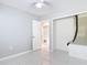 Bedroom boasting tile flooring, a walk-in closet, and bright, natural light at 1812 Bayview Dr, New Smyrna Beach, FL 32168