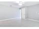 Neutral bedroom with tile flooring, ceiling fan, and plenty of natural light at 1812 Bayview Dr, New Smyrna Beach, FL 32168