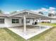 Exterior view of the home featuring a covered back patio at 1812 Bayview Dr, New Smyrna Beach, FL 32168