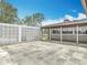 Covered patio featuring a decorative concrete privacy wall and brick exterior at 1812 Bayview Dr, New Smyrna Beach, FL 32168