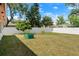 Expansive backyard featuring a lush lawn and privacy fence at 1851 Needle Palm Dr, Edgewater, FL 32141