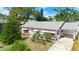 Charming single-story home featuring a well-maintained lawn and inviting curb appeal at 1851 Needle Palm Dr, Edgewater, FL 32141