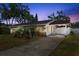 Charming home with well-maintained landscaping and a covered driveway at 1851 Needle Palm Dr, Edgewater, FL 32141