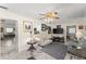 Bright Gathering room features marble flooring, a ceiling fan, and seamlessly connects to dining and kitchen areas at 1851 Needle Palm Dr, Edgewater, FL 32141