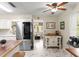 Bright kitchen featuring marble floors, stainless steel refrigerator, butcher block island, and an open design at 1851 Needle Palm Dr, Edgewater, FL 32141