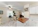 Sunny kitchen with marble flooring, a butcher block island, and white cabinetry offers an open and inviting space at 1851 Needle Palm Dr, Edgewater, FL 32141