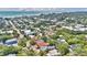 Wide aerial view of a coastal town showing homes, trees, and ocean at 209 Esther St, New Smyrna Beach, FL 32169