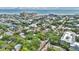 Stunning aerial view of a neighborhood near the beach, showcasing a mix of homes and lush greenery at 209 Esther St, New Smyrna Beach, FL 32169