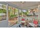 Cozy back porch with a view of the fenced yard and comfortable seating arrangement at 209 Esther St, New Smyrna Beach, FL 32169