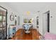Charming dining area with wooden floors, lots of natural light, and an open layout at 209 Esther St, New Smyrna Beach, FL 32169