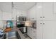 Modern kitchen featuring stainless steel appliances and all-white cabinetry at 209 Esther St, New Smyrna Beach, FL 32169
