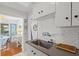 Modern kitchen featuring stainless steel appliances and modern white cabinetry at 209 Esther St, New Smyrna Beach, FL 32169