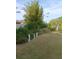 Landscaped backyard featuring lush greenery, garden statues, and a well-maintained lawn at 227 Two Oaks Dr, Edgewater, FL 32141