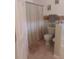 Neutral bathroom with a shower curtain, toilet, and neutral color scheme at 227 Two Oaks Dr, Edgewater, FL 32141