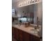 Bathroom featuring a double vanity and a large mirror and tub at 227 Two Oaks Dr, Edgewater, FL 32141
