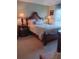 Cozy bedroom featuring elegant furniture, lamps and neutral decor at 227 Two Oaks Dr, Edgewater, FL 32141