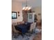 Formal dining room with table, chairs, chandelier, and a blue tablecloth at 227 Two Oaks Dr, Edgewater, FL 32141