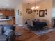 Open-concept dining room featuring an elegant chandelier and a blue tablecloth at 227 Two Oaks Dr, Edgewater, FL 32141