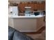 Cozy kitchen features wood cabinets, white appliances and breakfast bar for casual dining at 227 Two Oaks Dr, Edgewater, FL 32141