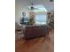 Bright living room featuring vaulted ceilings, large windows, ceiling fan, and comfortable furnishings at 227 Two Oaks Dr, Edgewater, FL 32141