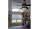 Living room with vaulted ceilings, large windows, ceiling fan, and comfortable seating area at 227 Two Oaks Dr, Edgewater, FL 32141