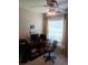 Functional office space with a ceiling fan and a bright window at 227 Two Oaks Dr, Edgewater, FL 32141