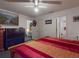 Primary bedroom features a large bed and two entry doors at 242 Cypress Ave, Oak Hill, FL 32759