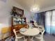 Cozy dining room featuring a round table, chairs, and a decorative hutch at 242 Cypress Ave, Oak Hill, FL 32759