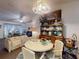Open floor plan shows dining area with hutch, round table and seating at 242 Cypress Ave, Oak Hill, FL 32759