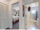 Hallway view showing access to a bedroom and a bathroom, with closet space at 242 Cypress Ave, Oak Hill, FL 32759
