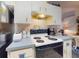 The kitchen is equipped with modern appliances and ample countertop space at 242 Cypress Ave, Oak Hill, FL 32759