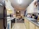 View from the kitchen into the dining area at 242 Cypress Ave, Oak Hill, FL 32759