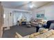 Cozy living room with blue accents, comfortable seating, and natural light, creating a welcoming and relaxing atmosphere at 242 Cypress Ave, Oak Hill, FL 32759