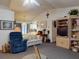 Open-concept living space with vaulted ceilings, comfortable furnishings, and seamless flow to the kitchen at 242 Cypress Ave, Oak Hill, FL 32759