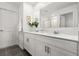 Modern bathroom boasts double vanity, white cabinets, and sleek fixtures creating elegant atmosphere at 2516 Hoptree Ln, Edgewater, FL 32141