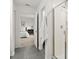 Bright bathroom with shower and bedroom doorway shows functional layout and modern design at 2516 Hoptree Ln, Edgewater, FL 32141