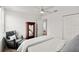 Bright bedroom featuring an accent chair, wardrobe, and a ceiling fan at 2516 Hoptree Ln, Edgewater, FL 32141