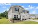 Charming two-story home featuring blue shutters, a manicured lawn, and a two-car garage at 2516 Hoptree Ln, Edgewater, FL 32141