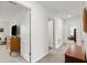 Bright hallway features neutral paint, carpeting, and access to rooms, creating seamless flow at 2516 Hoptree Ln, Edgewater, FL 32141