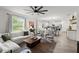 Open-concept living room flows seamlessly into the kitchen and dining area at 2516 Hoptree Ln, Edgewater, FL 32141