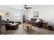 Relaxing living room featuring neutral tones, comfortable seating, and a ceiling fan at 2516 Hoptree Ln, Edgewater, FL 32141