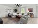 Bright and airy living room featuring a ceiling fan and comfortable seating area with natural light at 2516 Hoptree Ln, Edgewater, FL 32141