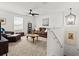 Cozy living room with comfortable seating, a ceiling fan, and decorative lighting fixtures at 2516 Hoptree Ln, Edgewater, FL 32141