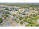 An aerial view of a neighborhood with mature trees and well-maintained houses in an established community at 2548 E Compton St, Orlando, FL 32806