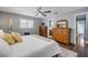 Large bedroom featuring wooden furniture, wood flooring and a king sized bed at 2548 E Compton St, Orlando, FL 32806