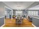 Charming dining room with hardwood floors and a view of the entryway and living room at 2548 E Compton St, Orlando, FL 32806