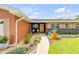 Close-up of home's front entrance with well-maintained landscaping at 2548 E Compton St, Orlando, FL 32806