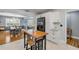 Bright kitchen with stainless steel appliances, island seating, granite countertops, and stylish cabinets at 2548 E Compton St, Orlando, FL 32806