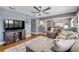 Spacious living room featuring a large sectional sofa, media center, and a view into the dining room at 2548 E Compton St, Orlando, FL 32806